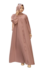 Woman wearing stylish pink buttoned modest dress and hijab