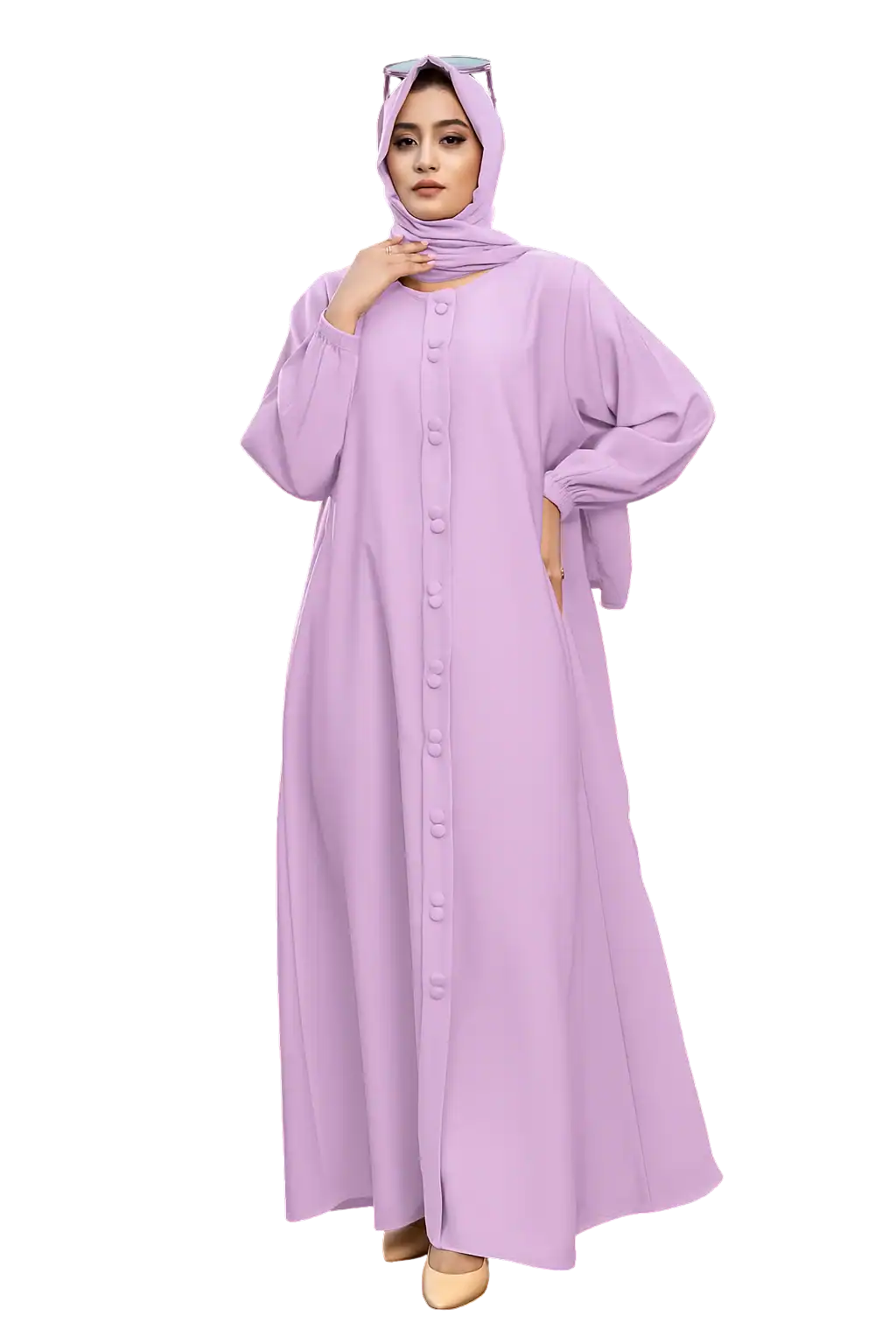 Woman in elegant lilac hijab and long dress standing confidently