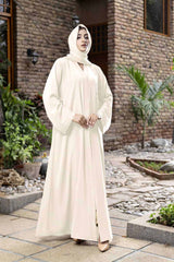 hijabi model with beige abaya posing outdoor