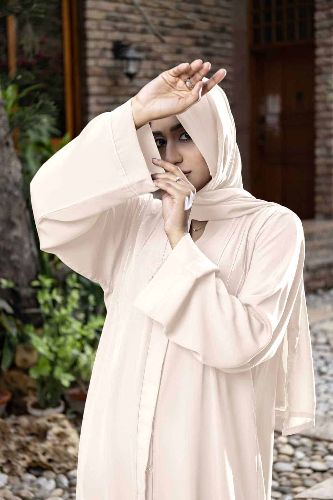 woman standing with a glow block pose