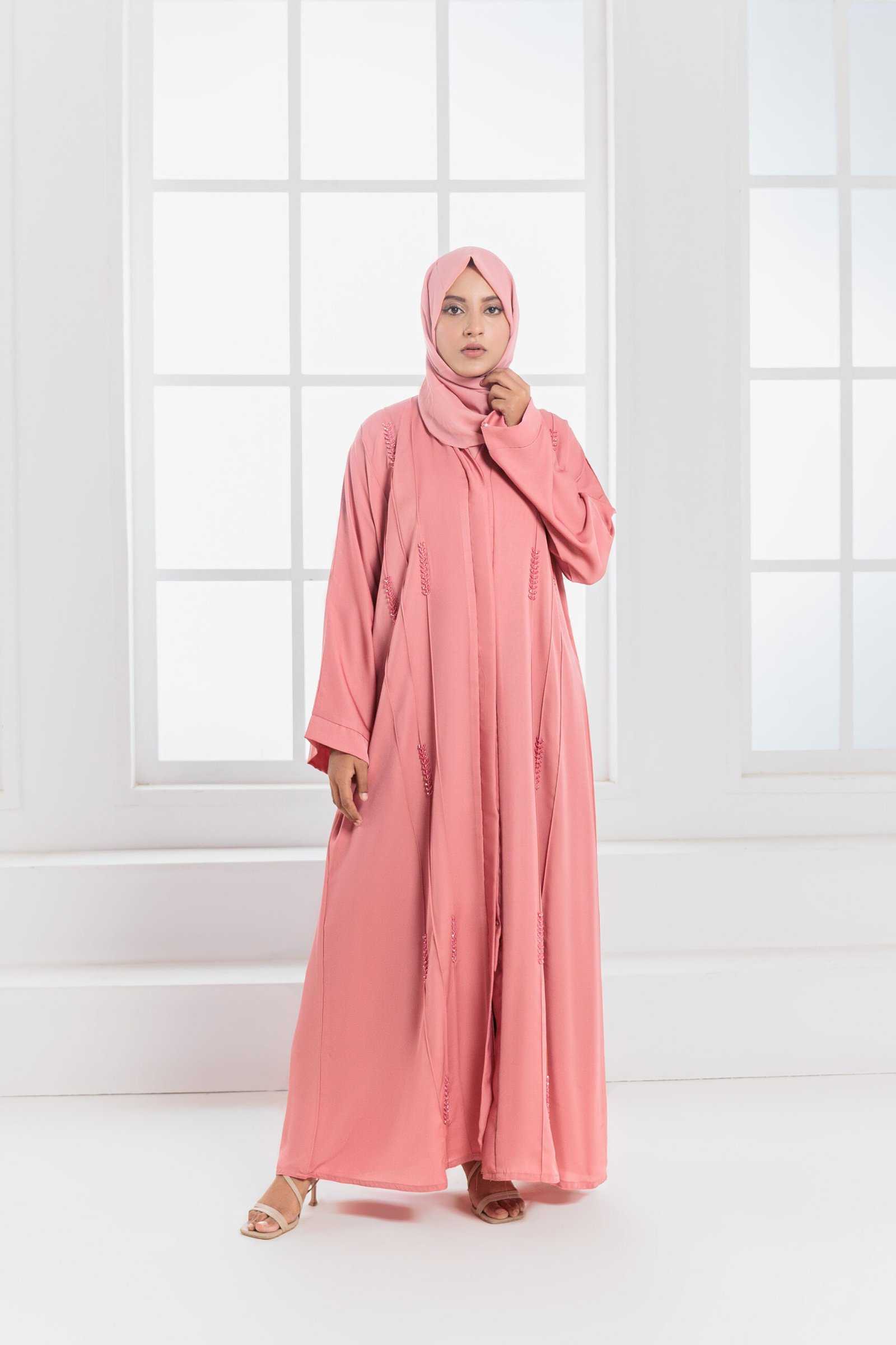 a model wearing pinkish style abaya